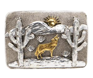 The Desert Coyote Belt Buckle features an intricate design of a howling coyote against a backdrop of mountains and cacti. With its antique gold and silver finish, this affordable option is a stylish addition to any wardrobe. Measuring 2 3/4" in height and 4" in width, the rectangular shape ensures a comfortable fit on belts up to 1 3/4" wide. You can easily purchase this buckle online or at our shop in Smyrna, TN, located just outside of Nashville.