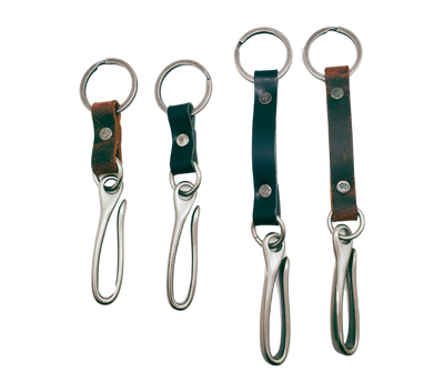 Keep your keys within reach with the Fish Hook Leather Belt Key Holder! Simply hook it onto your belt or belt loop and let it hang in your pocket. The key ring and hook are secured together by a piece of leather, making it convenient and easy to use. Available in both long and short options, you can go about your day knowing your important keys are always with you. Attach it to your belt, bag, or wherever you need it. Handcrafted in our Smyrna, TN shop, just outside of Nashville, TN.