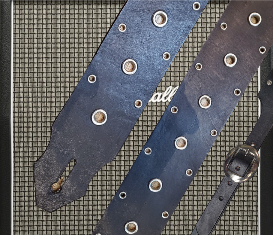 Studs and Eyelets like Marshalls have have been staple for years in Rock music!  "This 2" wide Guitar Strap is a nod to that classic influence. It's made from Pebbled Veg-Tan Cowhide and after some gig's it'll look like you bought in a Vintage shop. The classic adjustment style goes from approx. 42" to 56" at it's longest . Made just outside Nashville in our Smyrna, TN. shop. It will need a bit of time to "break in" but will get a great patina over time.