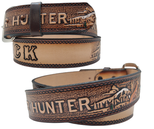 This Buck Fever all leather Name belt features a Deer Hunting pattern in an antiqued finish with a 1 1/2" width. It is crafted from full grain veg-tanned cowhide, with smooth burnished painted edges and a nickel-plated buckle. For customizing, simply type your desired name or No Name in the "Type Name Here" section, the buckle can be easily interchanged as well. This product is in stock at our Smyrna, TN shop.