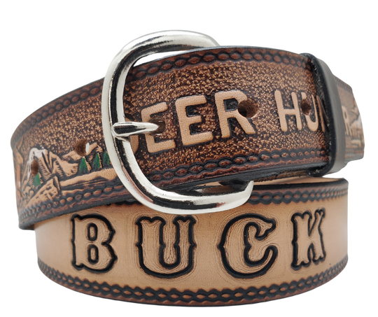 This Buck Fever all leather Name belt features a Deer Hunting pattern in an antiqued finish with a 1 1/2" width. It is crafted from full grain veg-tanned cowhide, with smooth burnished painted edges and a nickel-plated buckle. For customizing, simply type your desired name or No Name in the "Type Name Here" section, the buckle can be easily interchanged as well. This product is in stock at our Smyrna, TN shop.