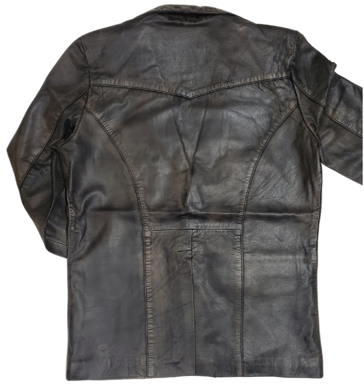 This butter-soft leather blazer jacket for men is delicately distressed in a rich brown hue. Its two pockets are thoughtfully designed for convenient storage, and it is proudly presented in-store at our Smyrna TN shop, located in close proximity to Nashville. Offering  luxury and refinement, this piece is sure to leave an unforgettable impression.