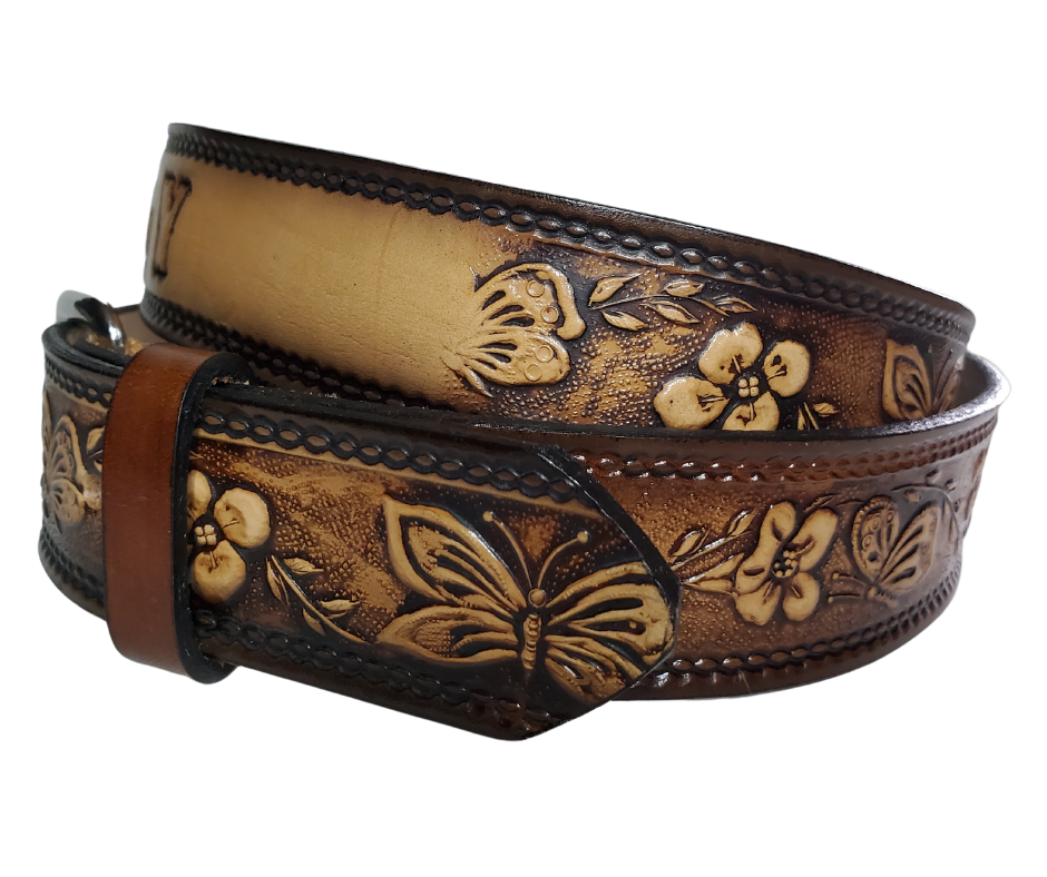  This Western styled leather Kid's belt features beautiful Flowers and Butterfly pattern that is sure to draw attention. The easy-change metal buckle makes for comfortable wear and makes it easy to add your own buckle. Perfect for adding a unique touch to any Kid's wardrobe. This belt is stocked in our shop outside Nashville in Smyrna, TN.