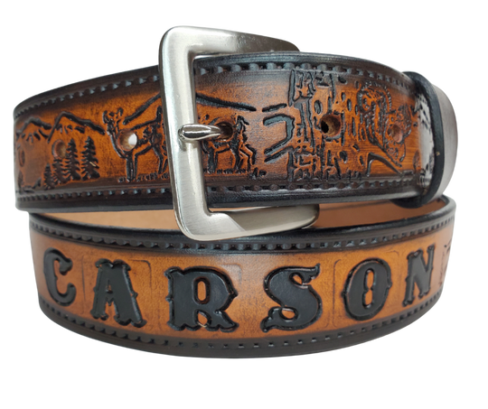 Our Frontiersman is named after the well known men who explored the original USA Frontier. This leather belt is crafted from high-quality Veg Tan cowhide and comes in four different color options. The edges are smooth and hand finished with a Deer and Squirrel outdoors scene. It's 1 1/2" wide, and available in sizes 34" to 44".  The removable Brushed Nickel plated solid brass buckle is attached with two snaps. Handmade in our Smyrna, TN, USA shop, just a short trip from Nashville.