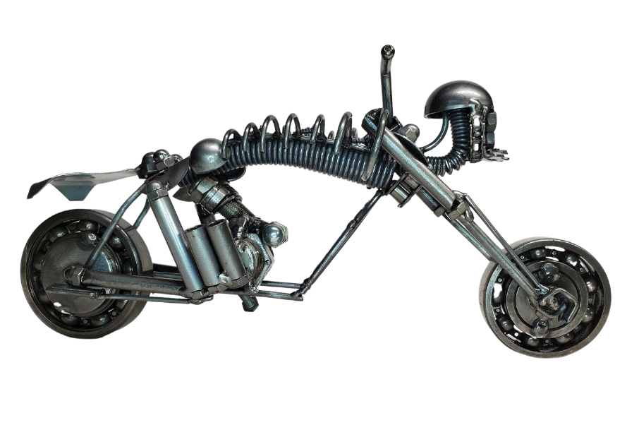 The perfect addition to your Man Cave! This metal art piece is a unique gift for any motorcycle enthusiast. Featuring nuts, bolts, springs, and bearing wheels, it also has a skull in place of a headlight. Need more details? Take a look at the picture for dimensions. This is our biggest piece in stock, and you can find it at our store in Smyrna, conveniently located just outside Nashville, TN.