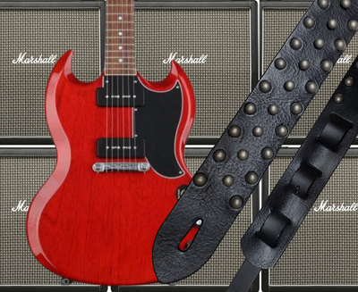 Metal Studs have been staple for years in Rock music!  "This 2" wide Guitar Strap is a nod to that classic influence. It's made from 1/8" thick Classic Black Pebble Grain Cowhide and after some gig's it'll look like you bought in a Vintage shop. The classic adjustment style goes from approx. 42" to 56" at it's longest . Made just outside Nashville in our Smyrna, TN. shop. It will need a bit of time to "break in" but will get a great patina over time.  