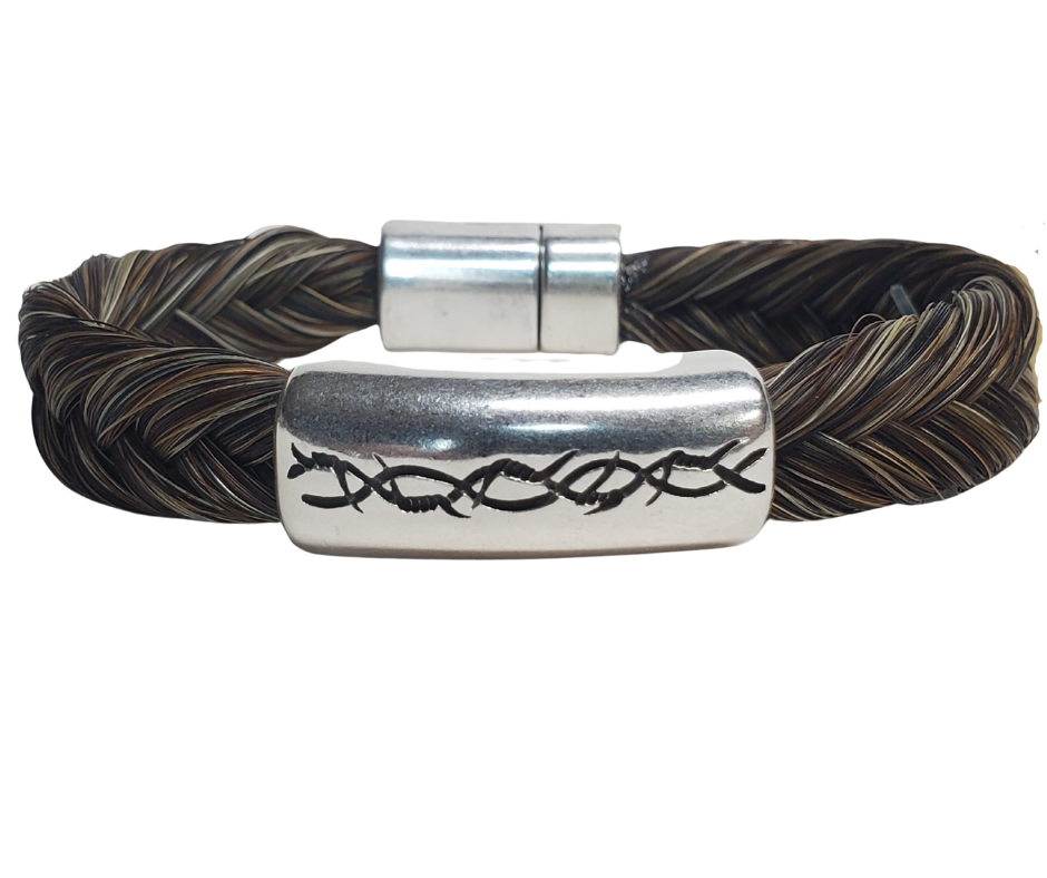 Discover the timeless charm of Barb Wire and Braided Horsehair in our classic Western style bracelet. Each piece features a strong magnetic clasp for durability. To ensure a comfortable fit, wear it snug or even take it in the water - just be sure to remove it before swimming or showering. You can find this unique bracelet at our shop in Smyrna, TN, conveniently located just a short drive away on I-24. Handcrafted in Montana with horsehair primarily sourced from Argentina, Mongolia, and Canada.
