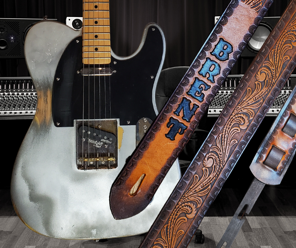 Great Session Musicians, and great songs have been a staple for years in Nashville. This Guitar Strap is a nod to those great Musicians influence! The 2' wide main Body of the strap is approx. 1/8" thick Embossed Veg-Tan Leather Strap with a CUSTOMIZABLE NAME FONT and Strap color. The classic adjustment style goes from approx. 42" to 56" at it's longest . Made just outside Nashville in our Smyrna, TN. shop. It will need a bit of time to "break in" but will get a great patina over time.