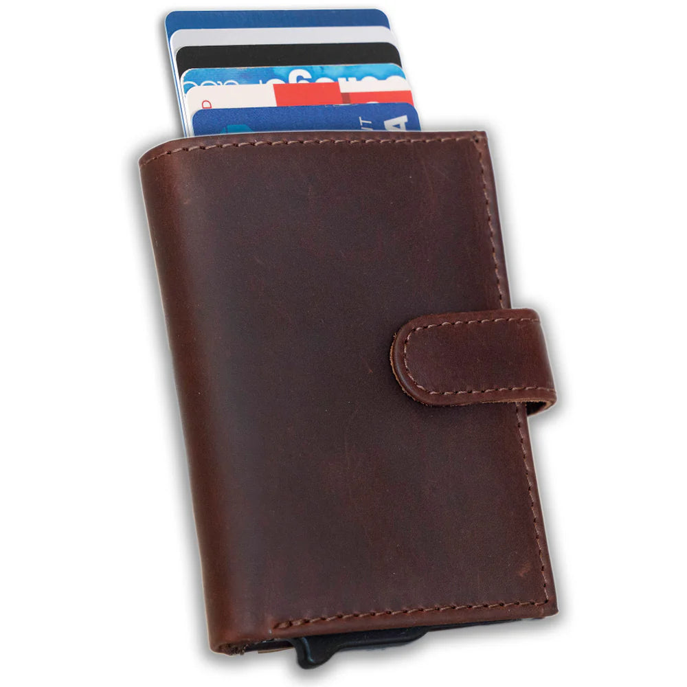 The Nova Auto Pop-Up Wallet is available at our Smyrna, TN shop. A minimalist design and practicality. Made from premium full-grain leather. It offers ample storage for up to 8 cards, an ID, bills, and coins. The unique auto pop-up mechanism allows quick access to your cards with a simple push, while built-in RFID protection keeps your personal information secure.
Wallet Dimensions: 4" L x 3" H x .75" D