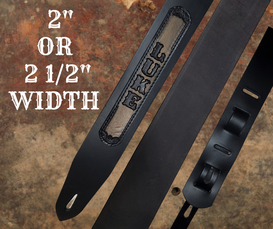 Acoustic Guitars and Great Songs and Lyrics have been staple for years in Country music!  "This 2" or 2 1/2" wide Guitar Strap is a nod to that classic influence. The main Body of the strap is approx. 1/8" thick Black Leather Strap with a CUSTOMIZABLE LEATHER NAME PATCH. The classic adjustment style goes from approx. 42" to 56" at it's longest . Made just outside Nashville in our Smyrna, TN. shop. It will need a bit of time to "break in" but will get a great patina over time.