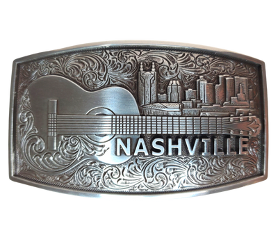 The "NASH" Buckle takes you to the beloved Nashville skyline complete with a whimsical bat tower building and an acoustic guitar. Show off your style with this 2 1/2" by 3 1/2" buckle and be inspired by the city made famous for risk-takers. Get yours online or in our Smyrna, TN shop, just outside Nashville. Dare to shine!