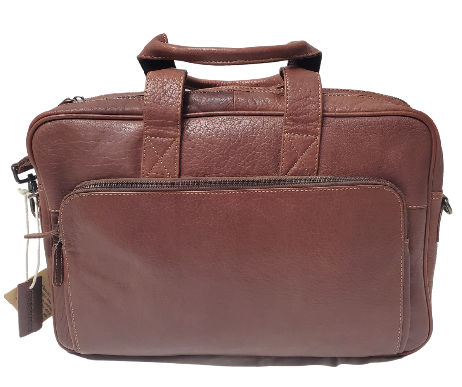 The Colonel Leather Laptop Bag is a no-frills bag that's perfect for the daily hustle. Crafted from buttery soft pebble grain leather, it only gets better with age. With a spacious main pocket, computer sleeve, and room for paperwork and snacks, it's got your weekday needs covered. Power cords? No problem! Just stash them in one of the two outside zippered pockets. And for ultimate convenience, it comes with an adjustable shoulder strap. Swing by our Smyrna, TN shop and snag one today!