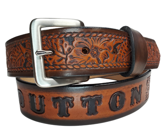 This personalized Vegtan leather belt, aptly named "The Ranch," with it's Western scroll pattern framed in a Rope edge border. Made in Smyrna, TN, close to Nashville. It's interchangeable solid brass buckle ensures convenience while maintaining high quality. Elevate any outfit with this stylish and versatile accessory.