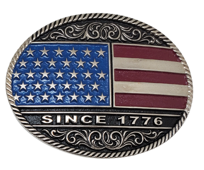 Be a true patriot with The "Declaration" Belt Buckle, featuring a timeless Western Scroll pattern, a rope edge, and iconic Red, White, and Blue colors. Its Antiqued silver finish and easy-to-wear oval shape make it a must-have for any belt measuring 1 1/2" wide. Find it online or at our shop near Nashville in Smyrna, TN. Crafted from durable metal alloy and coated with Montana Armor for long-lasting wear.