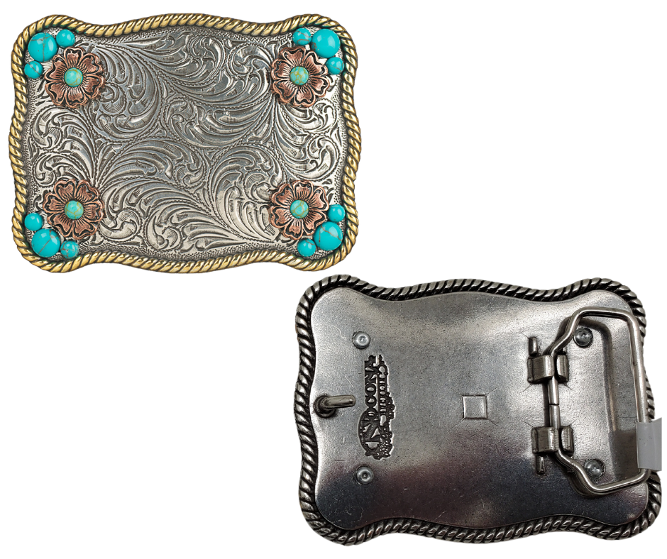 Sunsets are a divine gift. The "Sunset Flower" Belt Buckle takes your mind to one. Its rectangular shape, rope edge, and western floral background are accented by small Turquoise stones and Copper flowers. At 2 1/2" tall by 3 1/2" wide, this versatile buckle fits belts up to 1 1/2" wide and is available at our retail store in Smyrna, TN, near Nashville. We can't wait for you to see it!