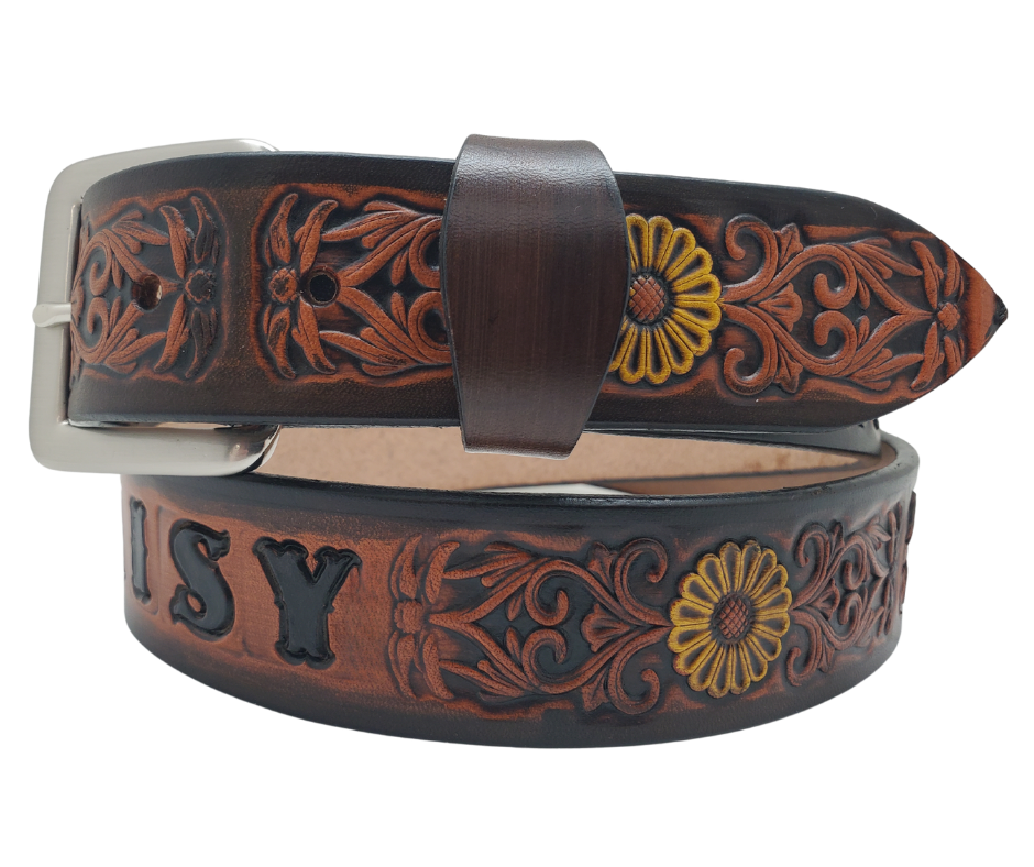 "The Sun Daisy" is a handmade real VEGTAN belt made from a single strip of cowhide shoulder leather that is 8-10 oz. or approx. 1/8" thick. It has hand burnished (smoothed) edges and Summer flowers embossed on the surface with HAND PAINTED in White and Yellow or White or Yellow. The antique nickel plated solid brass buckle is snapped in place with heavy snaps.  This belt is made just outside Nashville in Smyrna, TN.