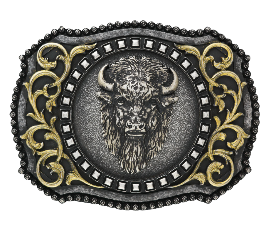 The Buffalo, a beloved Western symbol, now has a stylish and approachable accessory to complete your look. This rectangular belt buckle features a Brass-colored western scroll design with a Tantanka head in the center, surrounded by rounded bead edges. Measuring 3" tall by 4" wide, it's perfectly sized to fit belts up to 1 1/2" wide. You can find it at our retail shop in Smyrna, TN, located just outside of Nashville, or online.