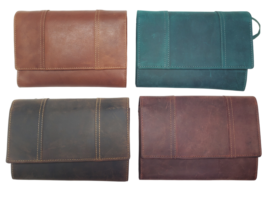 The Tiffany Crossbody Phone wallet is available at our Smyrna, TN shop not far from Nashville. This crossbody phone wallet has 2 accordion pockets, 1 zip pocket,6 additional card slots are placed in front of bag and is covered by flap with a magnetic catch. The inside flap has 5 card pockets and 1 window ID slot. Back of bag has half accordion zip pocket. Crossbody strap is detachable.
Bag size: 7.25” x 5”
4 internal card slots.
Choose from 4 colors