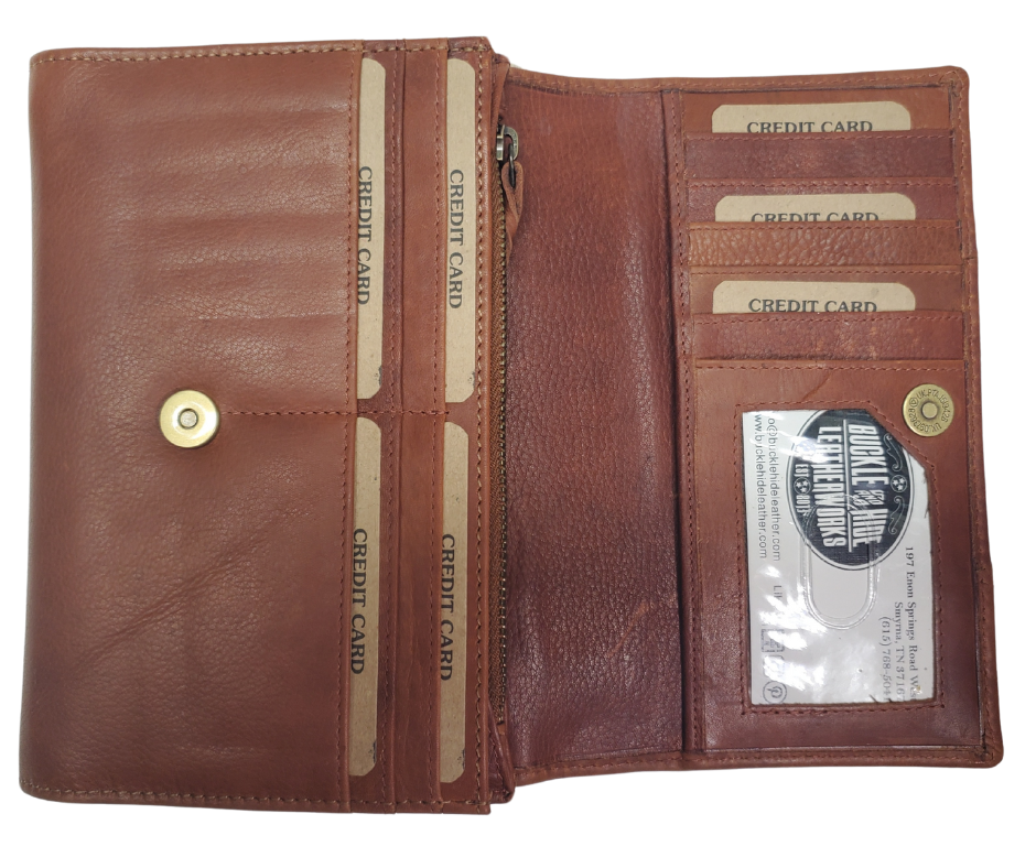 The Tiffany Crossbody Phone wallet is available at our Smyrna, TN shop not far from Nashville. This crossbody phone wallet has 2 accordion pockets, 1 zip pocket,6 additional card slots are placed in front of bag and is covered by flap with a magnetic catch. The inside flap has 5 card pockets and 1 window ID slot. Back of bag has half accordion zip pocket. Crossbody strap is detachable.
Bag size: 7.25” x 5”
4 internal card slots.
Choose from 4 colors