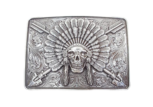 Ariat Indian Chief belt buckle Rectangle shaped buckle with a stylish smooth edge. It features a centered Indian chief skull with headdress and crossing arrows motif surrounded by western scroll engraving. Antiqued Chrome color. Measures 3-1/2" wide x 2-1/2" tall Fits belts up to 1 1/2" wide Available online or in our shop in Smyrna, TN just outside Nashville.