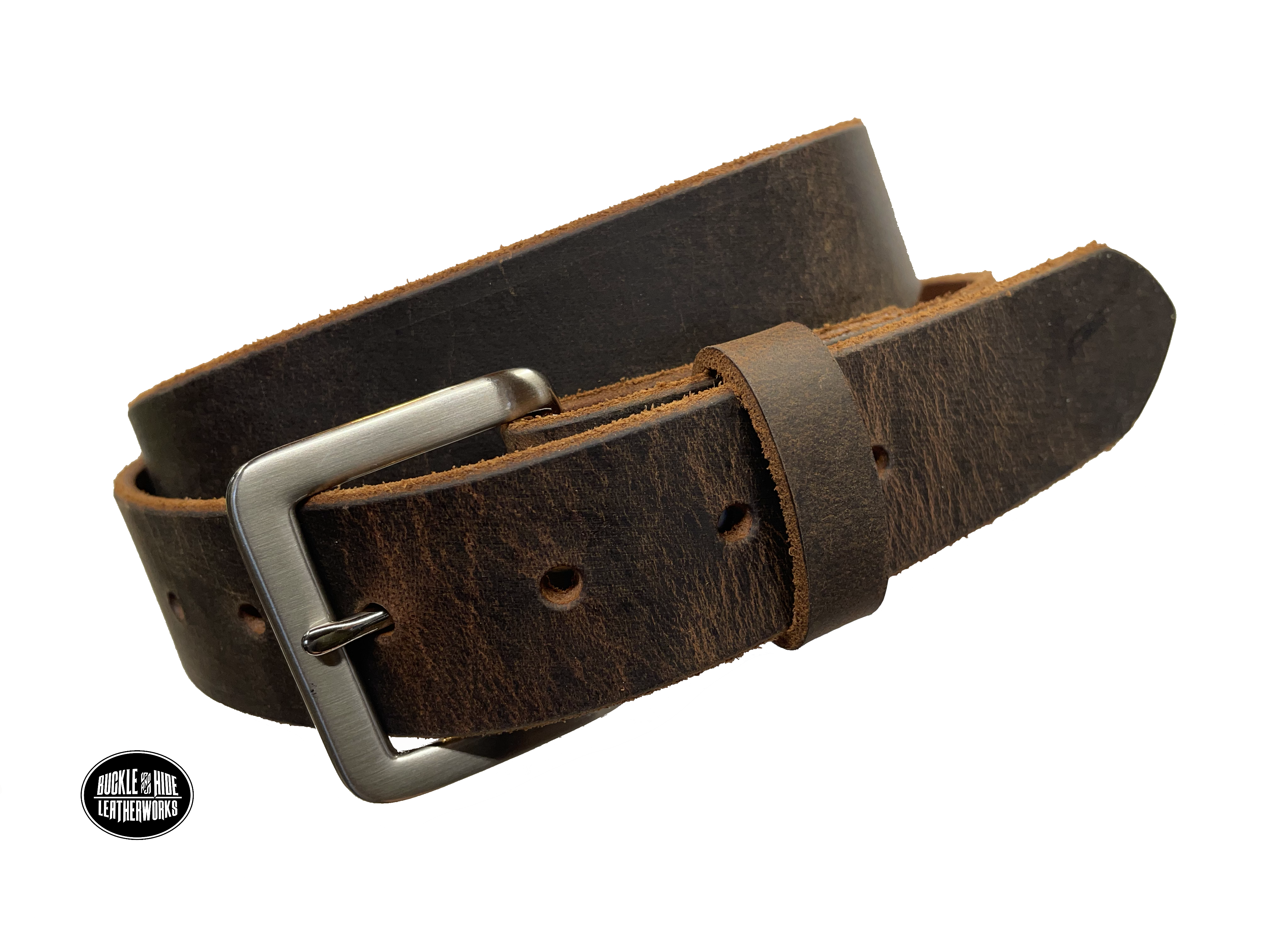 This brown leather belt is made from Crazy Horse tanned leather for that distressed and pull-up look. The edges are beveled and left raw for a contrasting look. It has an antique nickel coated solid brass buckle that is snapped in place. Belt is 1 1/2" wide and available in lengths from 34" to 44".  It is handmade in our shop in Smyrna, TN, just outside of Nashville. Choose Plain or Embossed Stitch pattern.