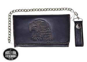 It's Cowhide LEATHER with a Eagle Head embossed that's slightly distressed brown! Popular Long Style Tri-fold Chain Wallet.  Nylon lined 6 card slots in the middle with a I.D. slot, 1 nylon lined zippered pocket, 3 underneath cash slots, for all your important stash. It's imported but it's Buckle and Hide approved. Complete with a 18" chrome plated chain (including leather belt loop. Standard long tri-fold size. Size is 7" x 3 1/2" when snapped closed.