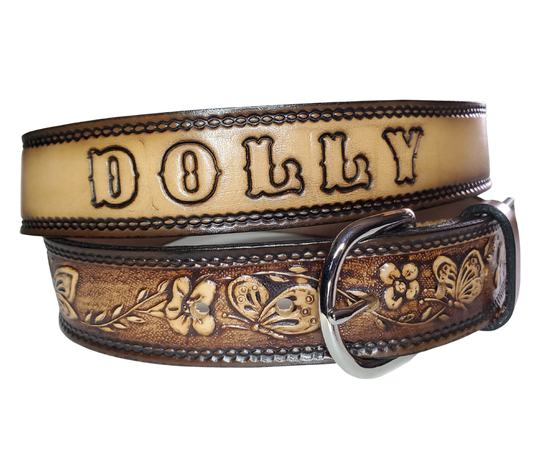 This stylish leather belt features beautiful flowers and butterfly artwork that is sure to draw attention. The easy-change metal buckle makes for comfortable wear and makes it easy to adjust for size. Perfect for adding a unique touch to any wardrobe. This belt is stocked in our shop outside Nashville in Smyrna, TN.