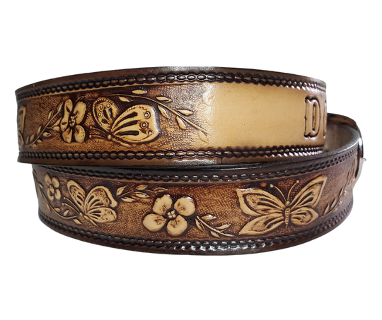 This stylish leather belt features beautiful flowers and butterfly artwork that is sure to draw attention. The easy-change metal buckle makes for comfortable wear and makes it easy to adjust for size. Perfect for adding a unique touch to any wardrobe. This belt is stocked in our shop outside Nashville in Smyrna, TN.
