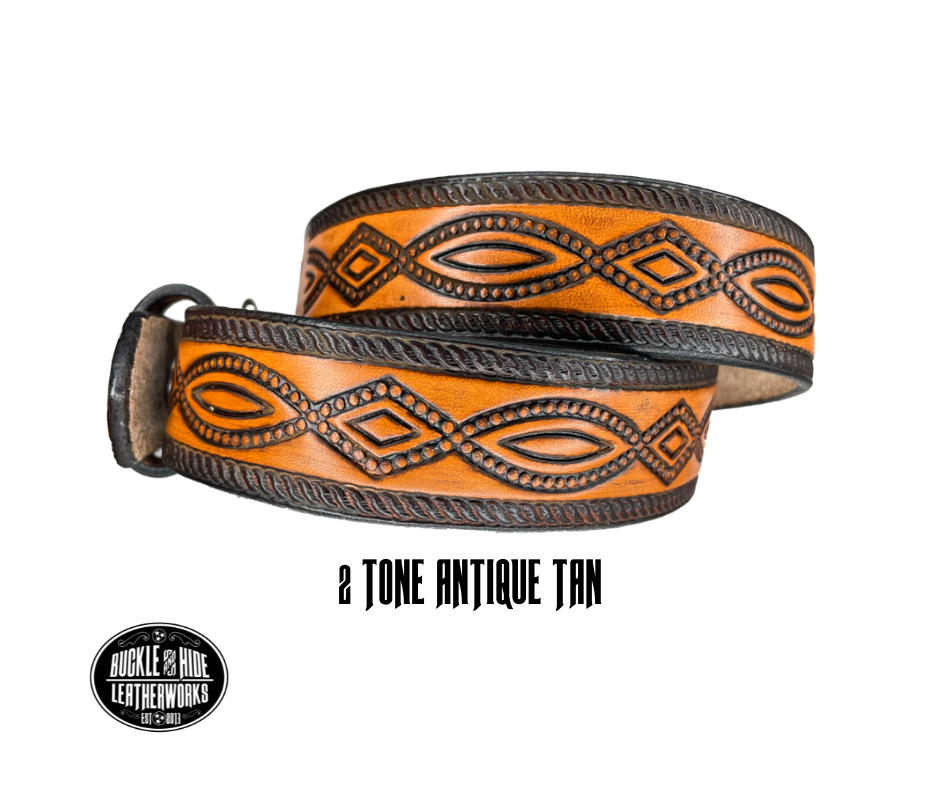 This solid strip of Veg Tan cowhide, is hand stained in classic 2 tone antique brown, with smooth, finished edges. Embossed with a classic FIGURE 8 pattern you'll see "The Stranger" wearing in well known "spaghetti" westerns down length of belt, or have name added to scene up to 8 letters. Belt thickness is approx. 1/8", and 1 1/2" wide. Sizes available are 34" to 44" from buckle end to hole most worn. Attached with 2 snaps is a Brushed Nickel plated solid brass buckle.