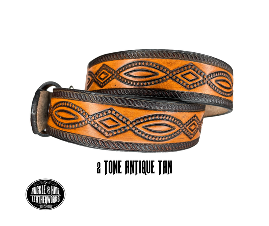 This solid strip of Veg Tan cowhide, is hand stained in classic 2 tone antique brown, with smooth, finished edges. Embossed with a classic FIGURE 8 pattern you'll see "The Stranger" wearing in well known "spaghetti" westerns down length of belt, or have name added to scene up to 8 letters. Belt thickness is approx. 1/8", and 1 1/2" wide. Sizes available are 34" to 44" from buckle end to hole most worn. Attached with 2 snaps is a Brushed Nickel plated solid brass buckle.