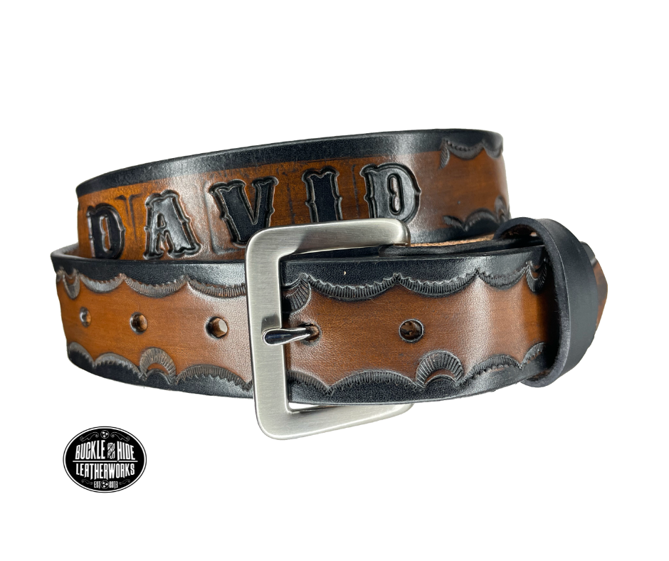 The Galinburg handmade all leather belt is made from a single strip of Veg-Tan cowhide or drum dyed (colored all the way through) Black cowhide shoulder leather.  The Black/Choc brown is a hand finished Veg-tan that is 9-10 oz., or approx. 1/8" thick.  The width is 1 1/2".  The antique nickel plated solid brass buckle is snapped in place. This belt is made just outside Nashville in Smyrna, TN. Perfect for casual and dress wear, it can be for personal use or for groomsman gifts or other gifts as
