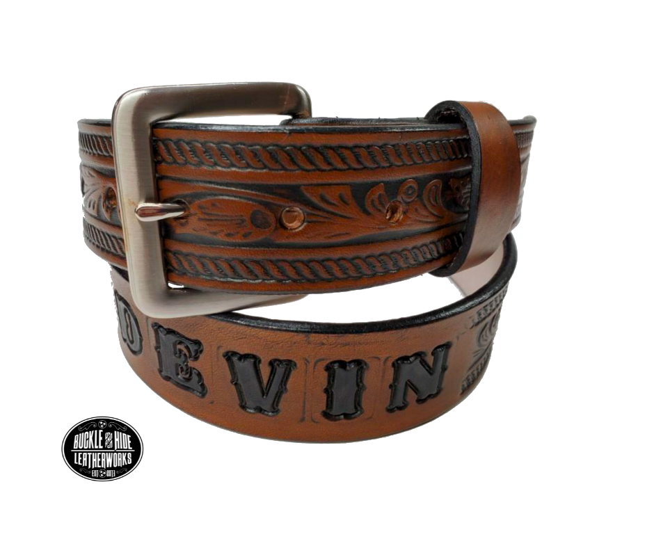 Be the star of the show with our "High Noon" Western Name Veg tan Leather Belt! Made with Veg tan cowhide in our Smyrna TN  shop just 20 miles outside of Nashville. It's designed for comfort and durability. Add a personalized name and change the buckle any time, all in 1 1/2" width of classic western style! Saddle up and get yours today!