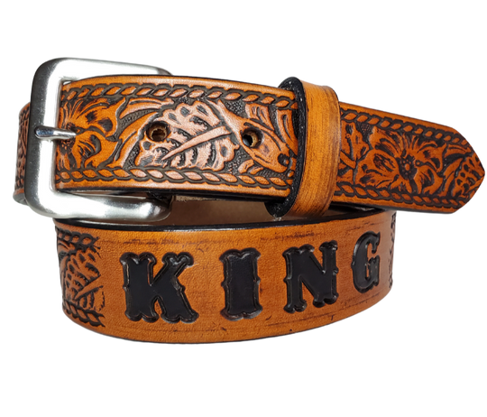 Our Lil Ranch is just like the Ranch for dad or mom. Full grain American vegetable tanned cowhide approx. 1/8"thick. Width is 1 1/4" and includes Antique Nickle plated Solid Brass buckle. We Hand Finished with a darker brown edge feathered into a tan center. Edges are smooth burnished painted edges. Made in our Smyrna, TN, USA shop. Buckle snaps in place for easy changing if desired  Choose with or without name,