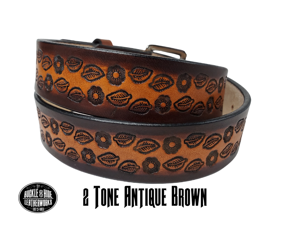 The Lily of the Valley handmade all leather belt is made from a single strip of Veg-Tan cowhide that is a hand finished Veg-tan that is 9-10 oz., or approx. 1/8" thick and is 1 1/2" thick. It has an Vintage style embossed design that is never out of style!  The antique nickel plated solid brass buckle is snapped in place. This belt is made just outside Nashville in Smyrna, TN. Perfect for casual and dress wear, it can be for personal use or for groomsman gifts or other gifts as well. 