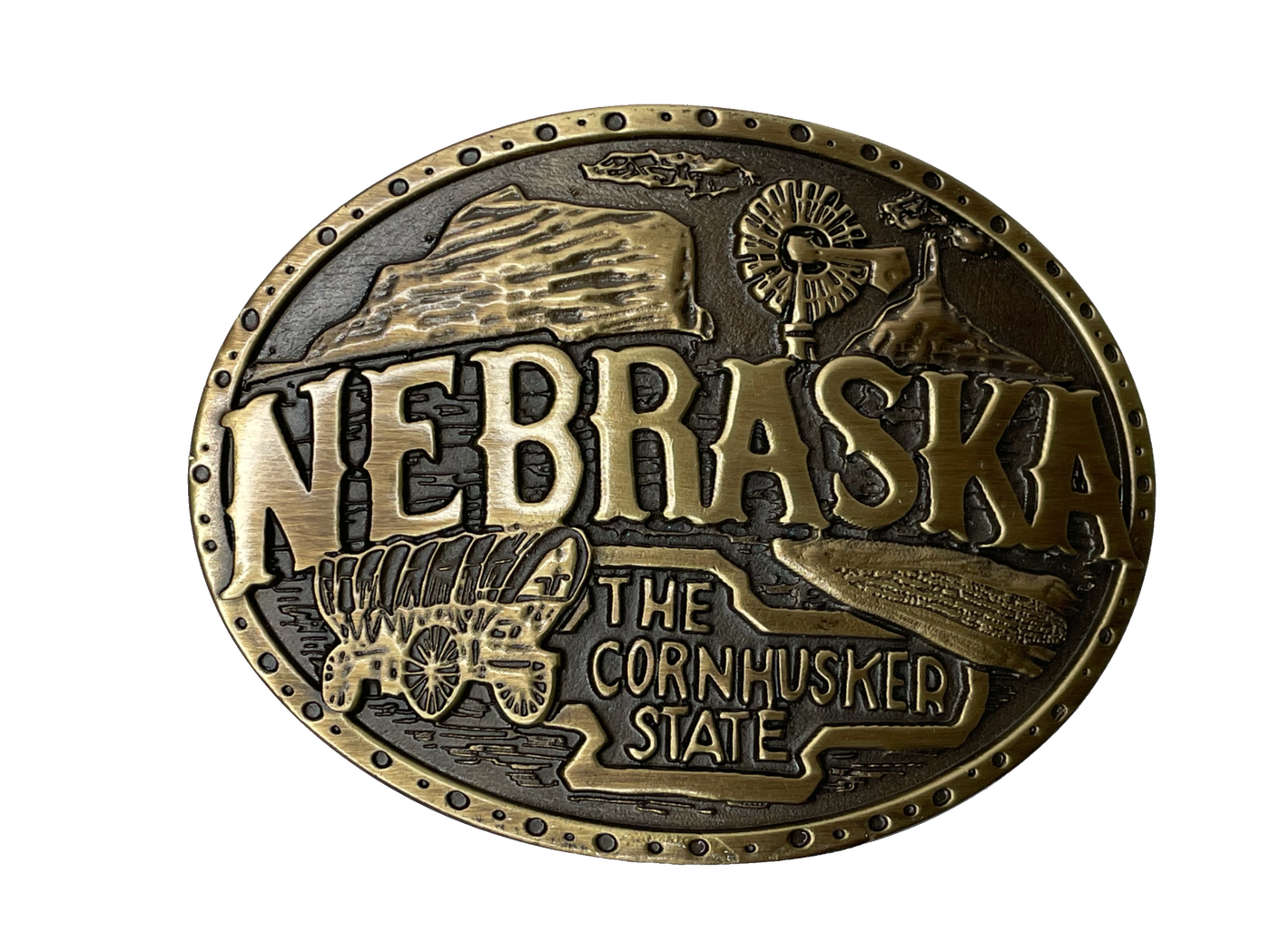 Nebraska State buckle by AndWest Dimensions are 3" tall by 3 3/4" wide Fits belts up to 1 1/2" wide Buckle is brass colored with Nebraska Cornhusker State embossed across front of buckle. Farming scene in the back behind "Nebraska". Back of buckle has Western scroll design Available in our online store and in the retail shop in Smyrna, TN, just outside of Nashville. Made in Mexico