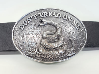 Oval shaped Nocona buckle Smooth edge and "Don't Tread On Me" motif Measures 2 1/2" tall by 3 1/2" wide Made in Taiwan Available online and in our shop in Smyrna, TN, just outside of Nashville