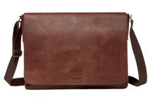 This 2 tone brown leather messenger bag is made from real cowhide leather.&nbsp; Flap is a smooth oil tanned leather with a distressed look and the body has contrasting soft pebbled grain leather. The flap secures with a magnetic snap. Dimensions are approx. 15" by 12" by 3". Back pocket will hold a full size laptop.&nbsp; Inner bag is lined with nylon and leather trim and hardware is brushed nickel. Available for purchase in our retail shop in Smyrna, TN, just outside Nashville.