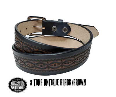 This handmade real leather belt is made from black, drum dyed cowhide shoulder that is 8-9 oz. or approx. 1/8" thick.  It is 1 1/2" wide and has a vintage design embossed on the surface with smoothed and burnished edges. The antique nickel plated solid brass buckle is snapped in place. Made just outside Nashville, in Smyrna, TN, you will find it is one of the longest lasting belts you will own.  It is made from a single strip of leather and is perfect for either casual or dress w