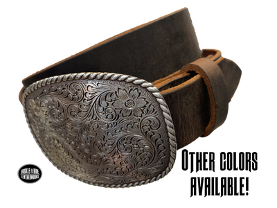 This rectangular shaped buckle by Nocona has rounded edges with rope design around the border. It is chrome colored with scroll design etched appearance on surface.  Measures 2 3/4" tall by 3 3/4" wide and fits belts up to 1 1/2" wide. Buckle is made in Taiwan. Belt is a single strip of leather that is 1 1/2" wide and available in sizes 34" to 44". Colors are distressed brown, black, and dark brown. Available online and in our shop in Smyrna, TN, just outside Nashville.