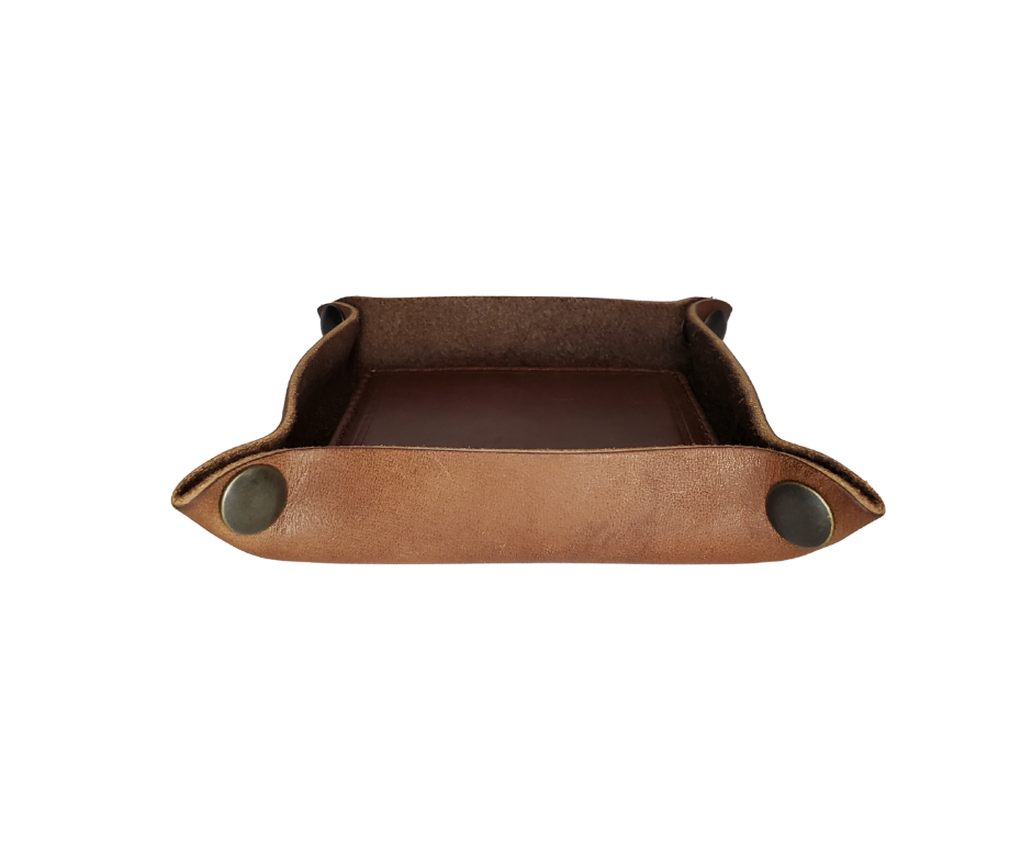 This handmade real leather valet tray has Antique Brass SNAPPED corners to FLATTEN out for easy packing for travel. It is made in our Smyrna, TN shop just outside Nashville.  The Stitched inside leather matches the outside for rustic look. It is a perfect catch-all for keeping keys and other small items in one place at the end of a long day.  Makes a great gift for groomsmen, or that special someone. ADD 3 initials, Available in 2 sizes. If you want 3 initials added, please type in CUSTOM box.