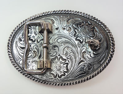Horsehead buckle by AndWest pictures a chrome colored background with Western scroll and flowered pattern.  Edge of the oval buckle has gold colored rope pattern along the edge and horse head is gold colored and centered on buckle. Works great for child's belt or adult who wants a smaller buckle Fits belt widths up to 1 1/4" Dimensions are 2 3/8" tall by 3 1/4" wide Available in our online store and also in the retail shop in Smyrna, TN, just outside of Nashville. Back side of buckle pictured.