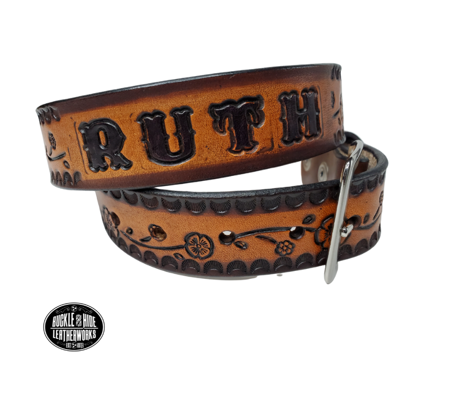 The Esther handmade all leather belt is made from a single strip of Veg-Tan cowhide that is a hand finished Veg-tan that is 9-10 oz., or approx. 1/8" thick and is 1 1/2" thick. It has an Vintage style embossed design that is never out of style!  The antique nickel plated solid brass buckle is snapped in place. This belt is made just outside Nashville in Smyrna, TN. Perfect for casual and dress wear, it can be for personal use or for groomsman gifts or other gifts as well. 