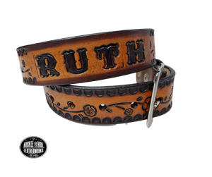 The Esther handmade all leather belt is made from a single strip of Veg-Tan cowhide that is a hand finished Veg-tan that is 9-10 oz., or approx. 1/8" thick and is 1 1/2" thick. It has an Vintage style embossed design that is never out of style!  The antique nickel plated solid brass buckle is snapped in place. This belt is made just outside Nashville in Smyrna, TN. Perfect for casual and dress wear, it can be for personal use or for groomsman gifts or other gifts as well. 