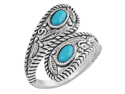 Open ring that is antiqued-silver in color and wraps around the finger to overlap. The twists and curls of the silver are accented by etched florals and filigree. The ends are teardrop in shape and hold a turquoise stone in the middle. Stone color and shape may vary. Rhodium over a sterling silver base. Synthetic turquoise. Available online or at our shop just outside Nashville in Smyrna, TN. 