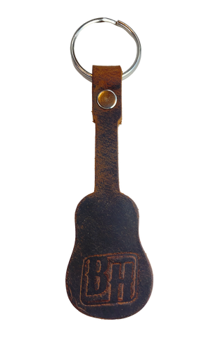 Handmade Brown distressed leather keychain in the shape of a guitar embossed with Buckle and Hide "B&H" logo. BUY MORE and SAVE! Made in our shop in Smyrna, TN, just outside Nashville. Key ring is split ring and leather is attached with a single rivet.