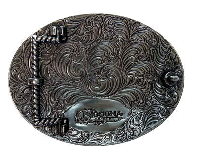 Antique silver with Black stars with a ornate western scroll in the background. Oval shape is good for most body types without digging in to your mid section. Fits up to 1  1/2" belts. Dimensions are approx. 3 1/4" tall x 4 1/4"wide.