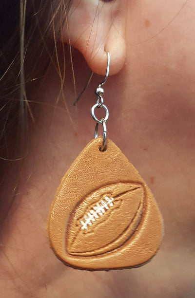 Handmade Football design leather earrings Made from brown Cowhide Leather tanned in USA Earrings made in Smyrna, TN, USA Nickel free iron ear wires