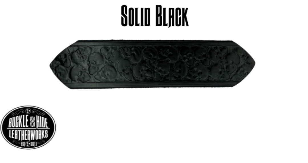 "The Forsaken" is a handmade real leather belt made from a single strip of cowhide shoulder leather that is 8-10 oz. or approx. 1/8" thick. It has hand burnished (smoothed) edges and the Serpent pattern embossed on the surface. The antique nickel plated solid brass buckle is snapped in place with heavy snaps.  This belt is made just outside Nashville in Smyrna, TN. Belt width is 1 1/2". Color options black/mahogany and solid black