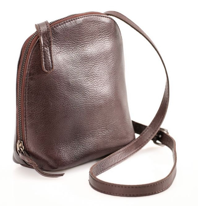 The Shaina Handbag is another one of our Minimalist mindset bags. It's crossbody style has a slit top pocket on the back suitable for most phones. The inside pocket has a zippered pocket divider, 6 card size slots, and 2 more open top pockets as well. Available now at our store in Smyrna, TN!

Choose from 5 Colors.
Measurements: 6" x 2.75" x 7"
