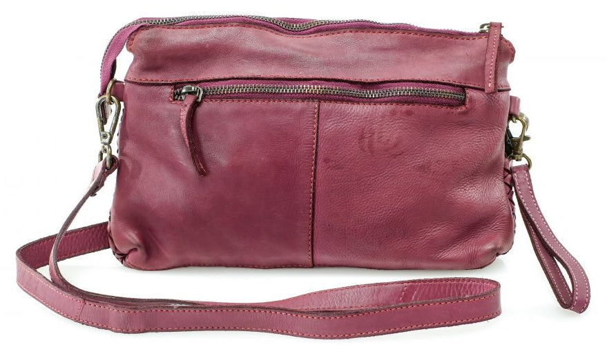 The Eve is made from soft tumbled leather and has a Woven front. The back side has a zippered pocket that will hold most smaller phone sized items. The main open inside pocket has one zippered pocket, 2 open top pockets 4 card size slots and one more smaller pocket next to to the cards. May be carried with the Wrist loop or as a Crossbody style with the included strap. The liner is a cotton fabric. Available now at our store in Smyrna, TN!

Measurements: 10" x 1" x 6"
